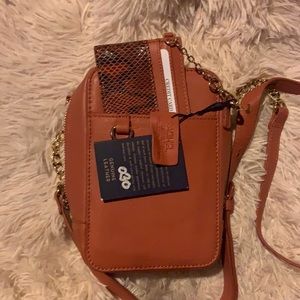 Cross body real leather hand bag, with Gold chain.